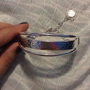 Silver cuff bracelet with clasp closure